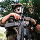 A man in full military gear pose for photo holding a gun during an open carry protest on July 4, 2020 in Richmond, Virginia. People attended an event in Virginia tagged “Stand with Virginia, Support the 2nd Amendment.”